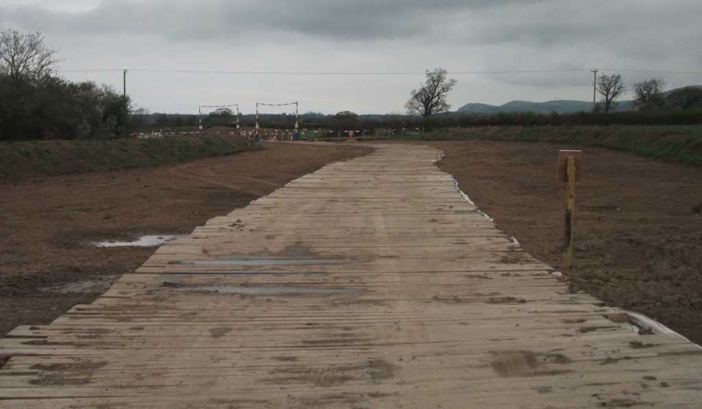 temporary timber roadway through dirt